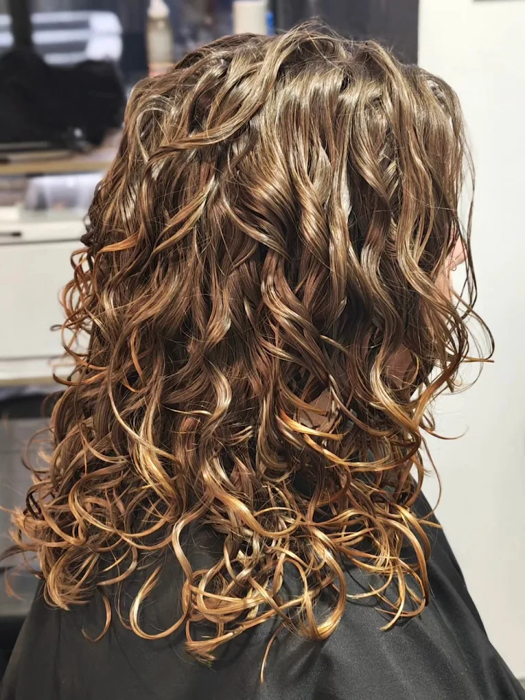 Personalised haircut with balayage highlights | True Hair Collective Sydney CBD Long hair with honey balayage highlights and defined natural texture at True Hair Collective Sydney CBD